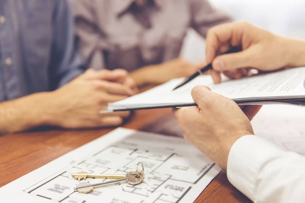 Property Manager Assisting Couple